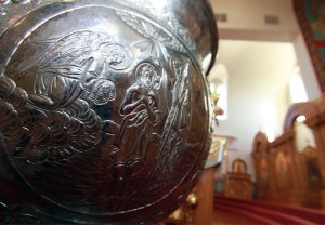 This image depicts the baptismal font used in St. Sava Serbian Orthodox Church, Merrillville, Indiana. Etched on one side is the scene commemorating Christ’s baptism by John the Forerunner in the River Jordan, and the beginning of Christ’s earthly ministry.